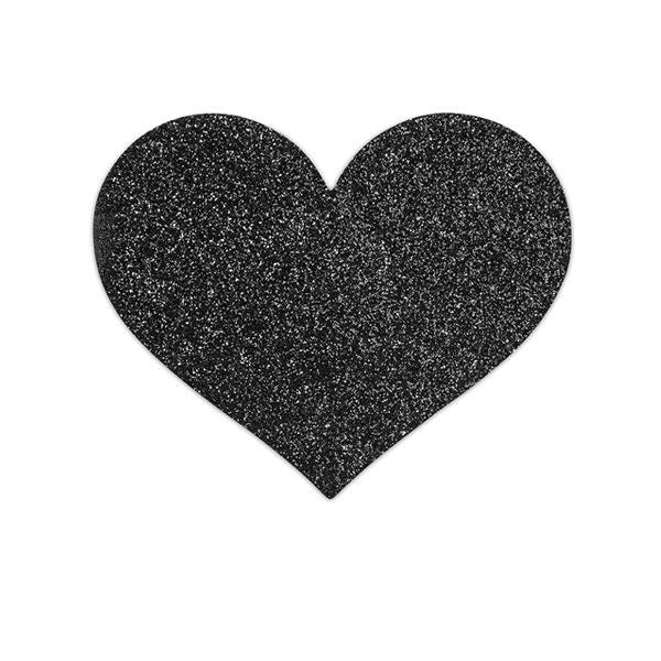 Close-up dos adesivos BIJOUX - INDISCRETS Flash Black Heart para mamilos, com design de coração e brilho