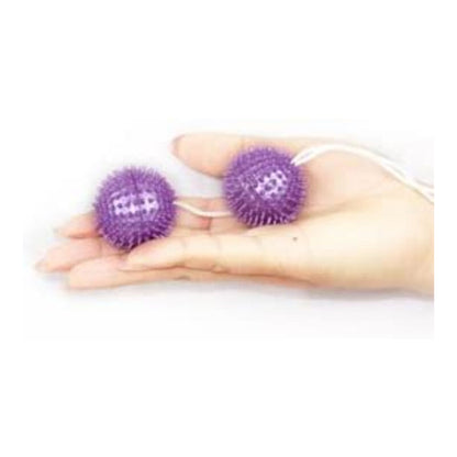 Close-up of the BAILE Textured Vaginal Balls 3.60 CM in purple, highlighting their design.