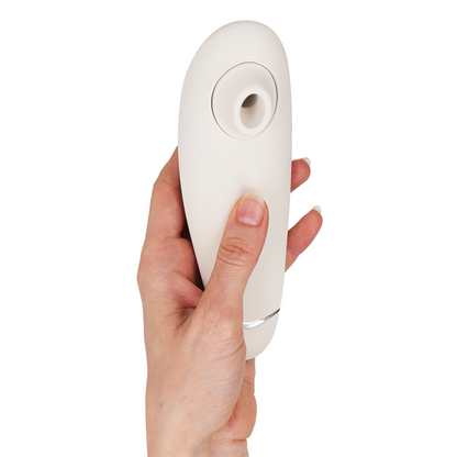 Close-up of the Womanizer Premium 2 Estimulador Clitoriano Warm Grey showing its innovative Pleasure Air Technology nozzle.