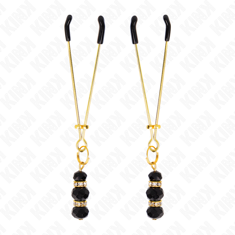Close-up das Pinças para Mamilos KINK Finas Douradas com 3 Contas Pretas, destacando o design elegante e os detalhes.
