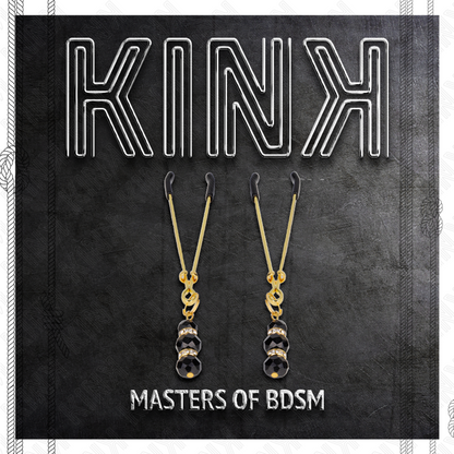 Close-up das Pinças para Mamilos KINK Finas Douradas com 3 Contas Pretas, destacando o design elegante e os detalhes.