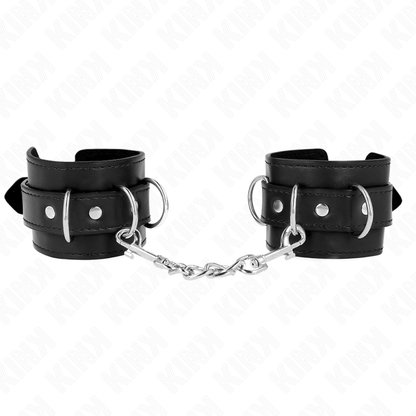 KINK Algemas de Pulso D-Ring ajustáveis pretas, mostrando os detalhes das 3 retenções e argolas D.