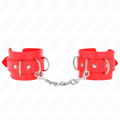 Close-up das retenções de pulso KINK D-Ring ajustáveis em vermelho.