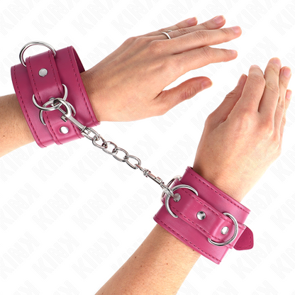 Conjunto de 3 retenções de pulso KINK D-Ring ajustáveis na cor rosa para sessões BDSM.