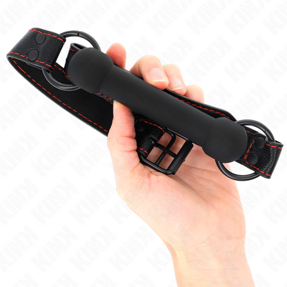 Mordaça de osso KINK com alça de couro preta ajustável para sessões BDSM, detalhe do design realista e material de qualidade.