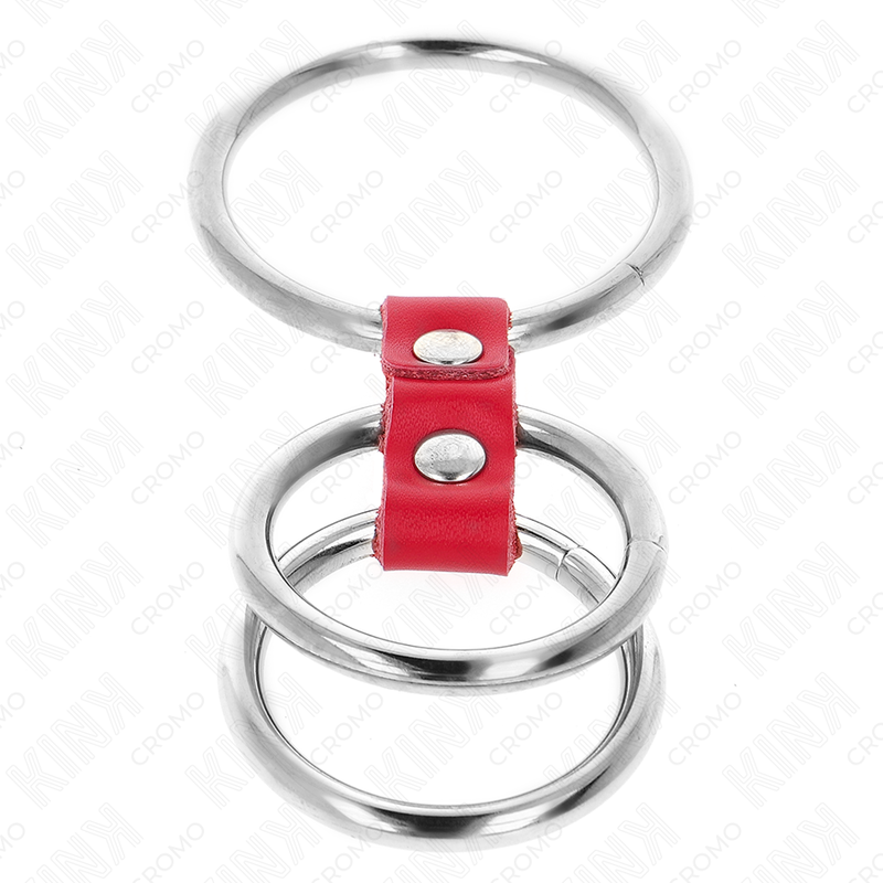 Close-up do KINK Anel Peniano Triplo de Metal com Couro Vermelho, mostrando seus materiais e design.