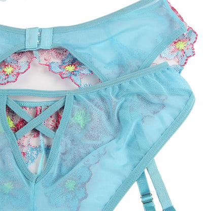 Conjunto de lingerie floral azul SUBBLIME com sutiã, calcinha e cinto-liga.