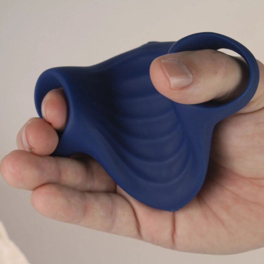 Close-up of the ROCKS-OFF Masturbador Vibrador Flexível Palm Blue showing its ergonomic design and textured interior.