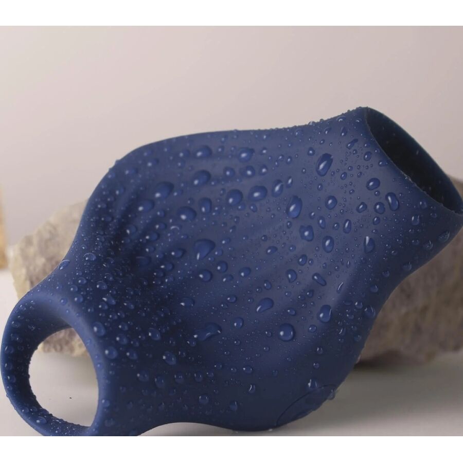 Close-up of the ROCKS-OFF Masturbador Vibrador Flexível Palm Blue showing its ergonomic design and textured interior.