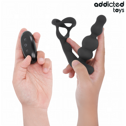 Close-up do Addicted Toys Massageador de Próstata Rotativo, destacando seu design ergonômico e controle remoto.